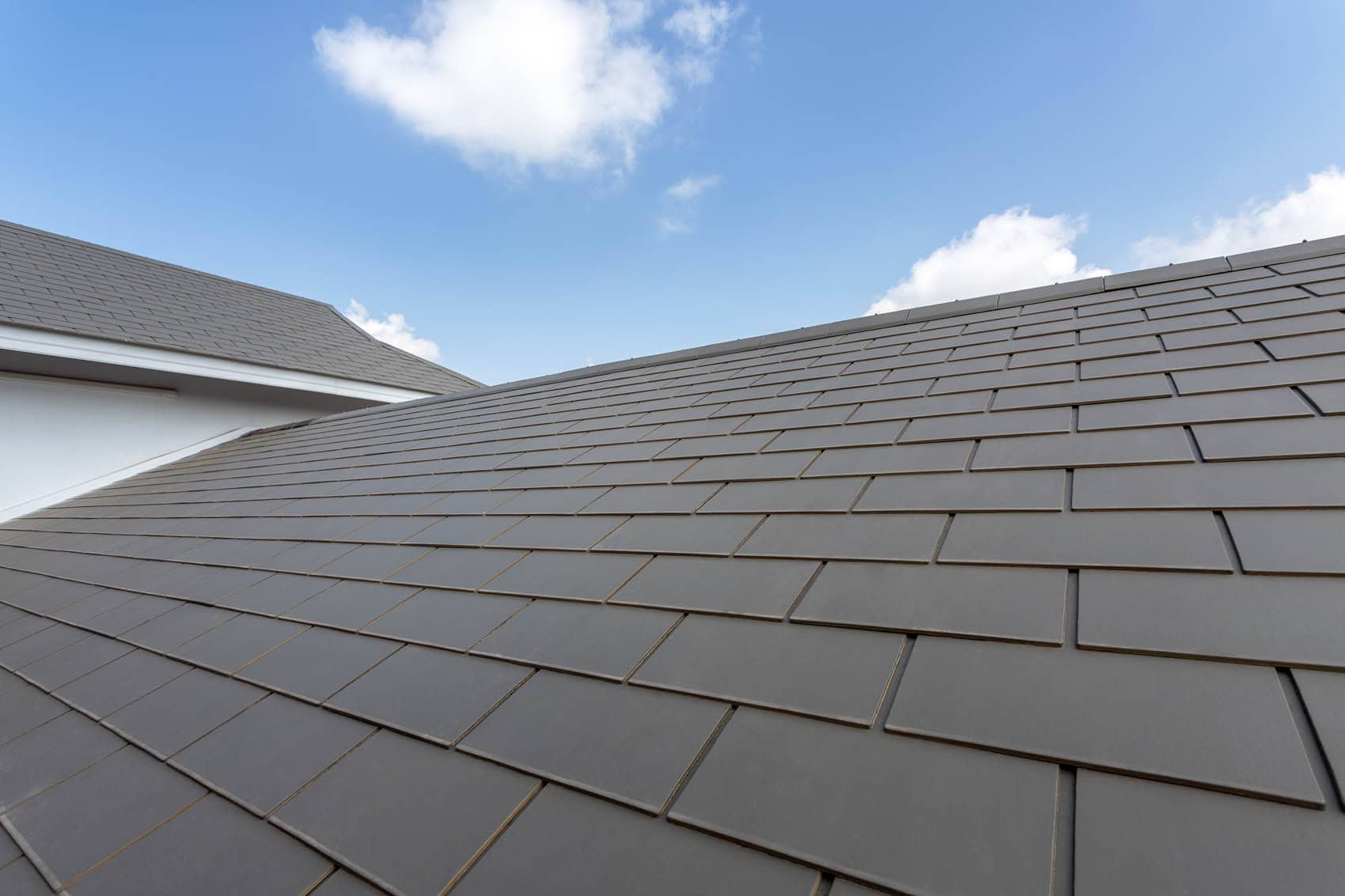 Large Modern Clean Slate Roof And Blue Sky