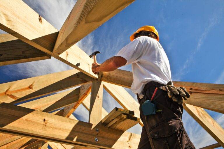 Builder making a roof support frame