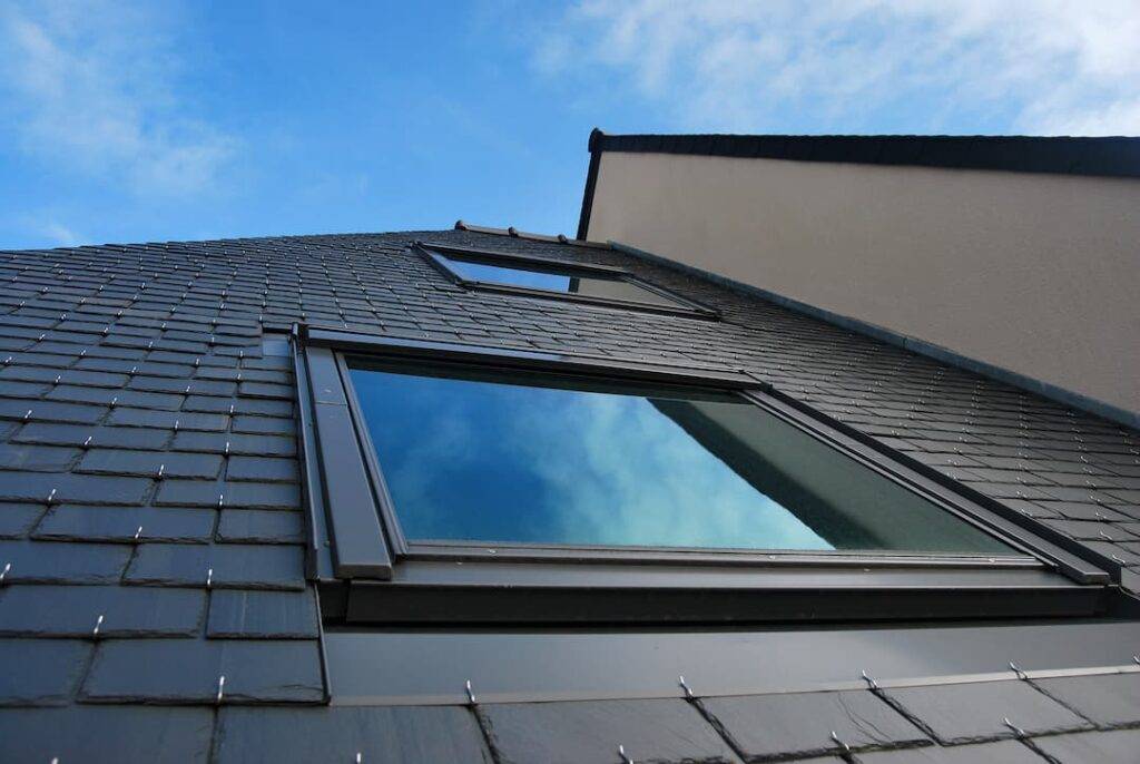 slate roof with skylight in sunshine